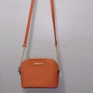 Orange half chained Steve Madden crossbody bag